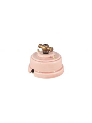 Выключатель (переключатель) фарфоровый поворотный одноклавишный проходной, цвет rosa (розовый), ручка бронза